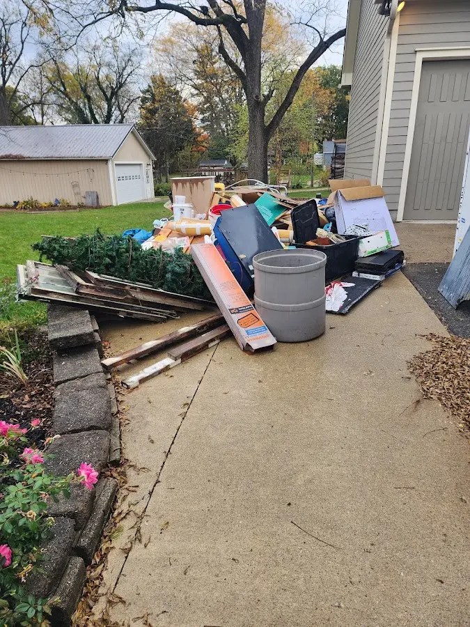 Dumpster being loaded with debris for 30 Yard Dumpster Rental in Ludlow